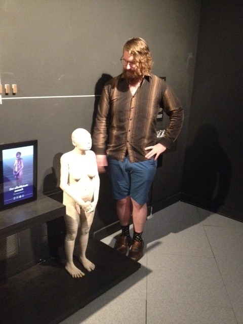 Me with a life-size reconstruction of Homo floresiensis , at a wonderful exhibit on hominid evolution at the Royal Belgian Institute of Natural Sciences.