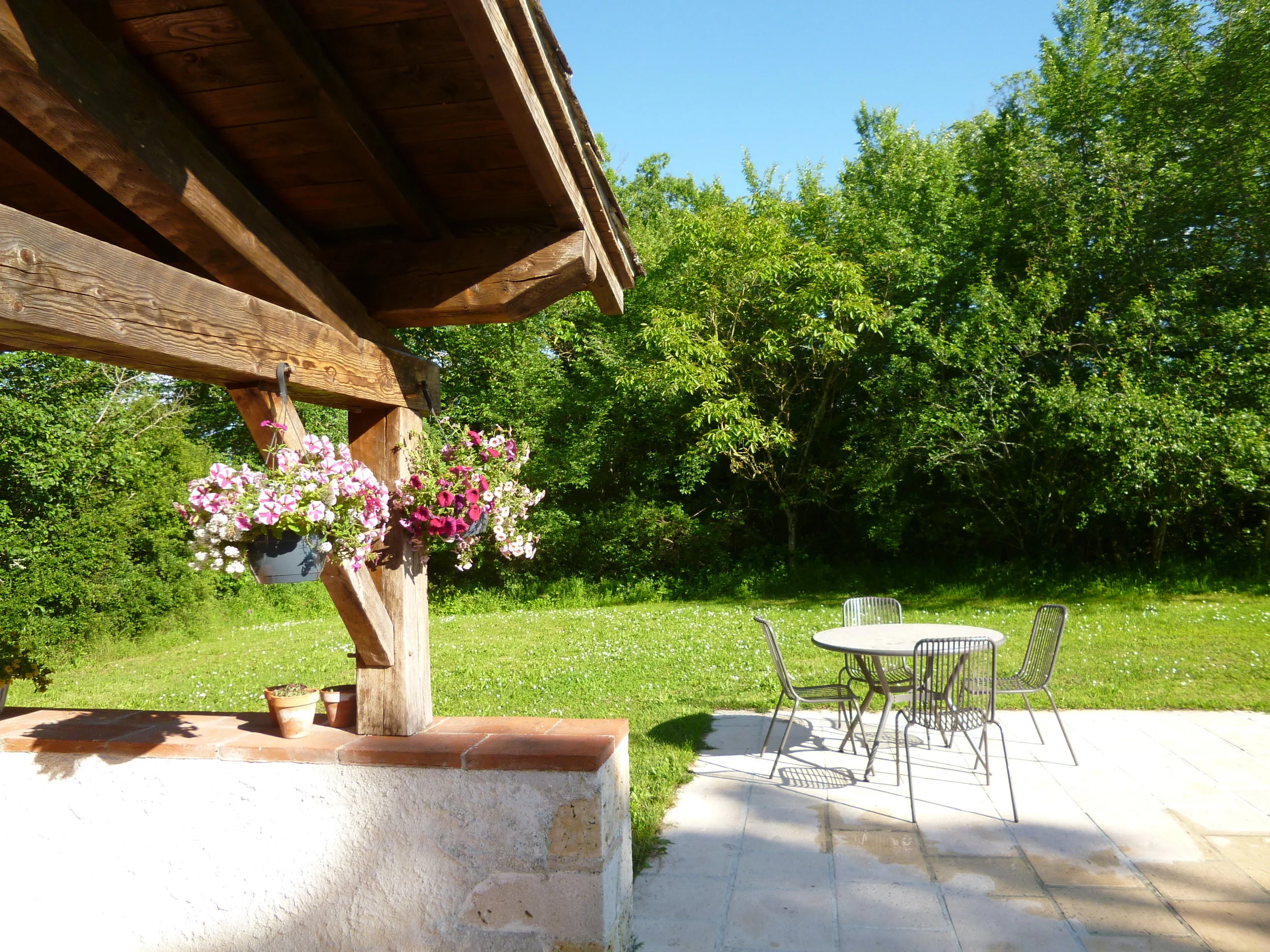 The edge of the pool house and pool patio.