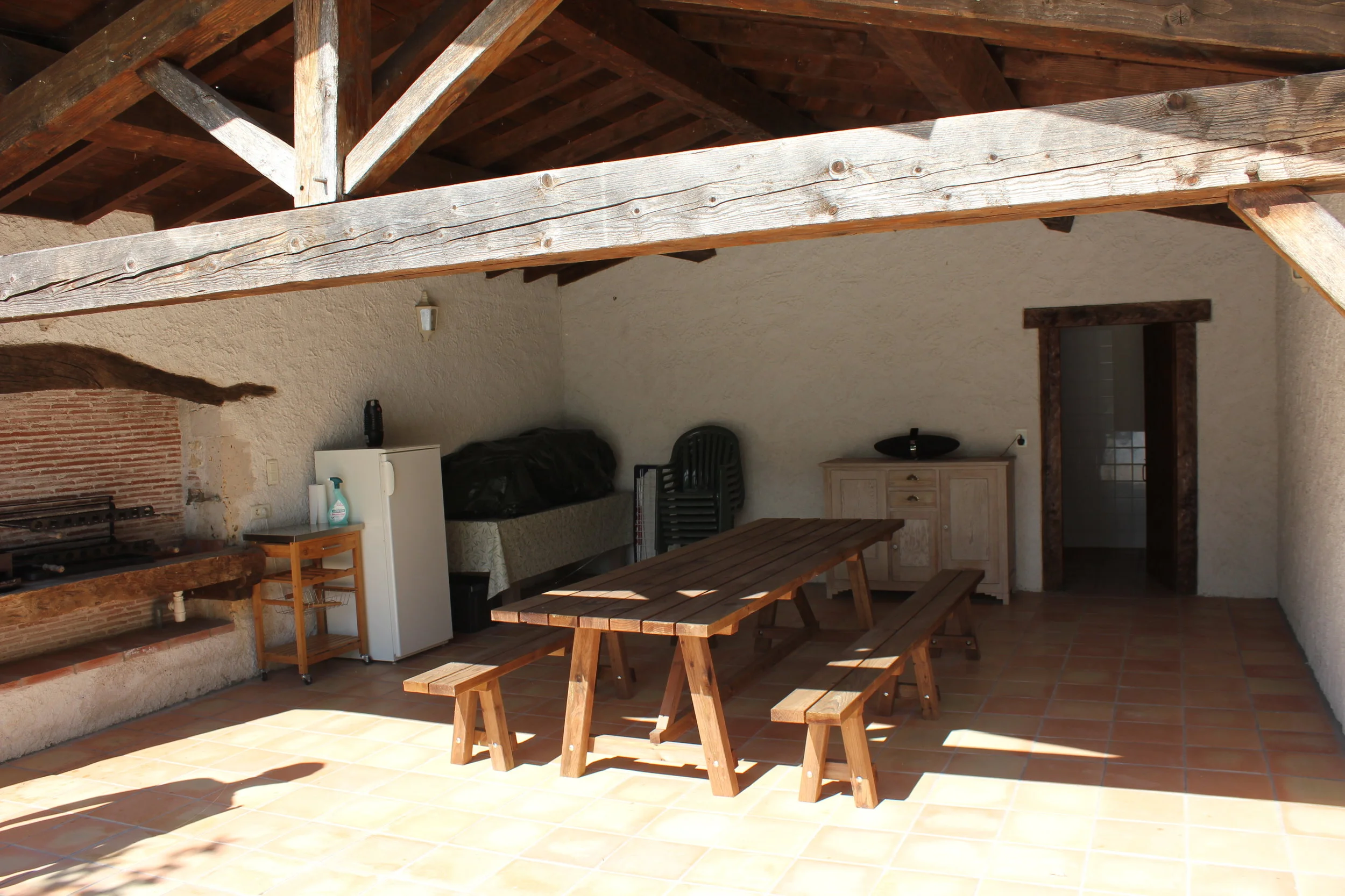The table and benches in the pool house at The Farmhouse.
