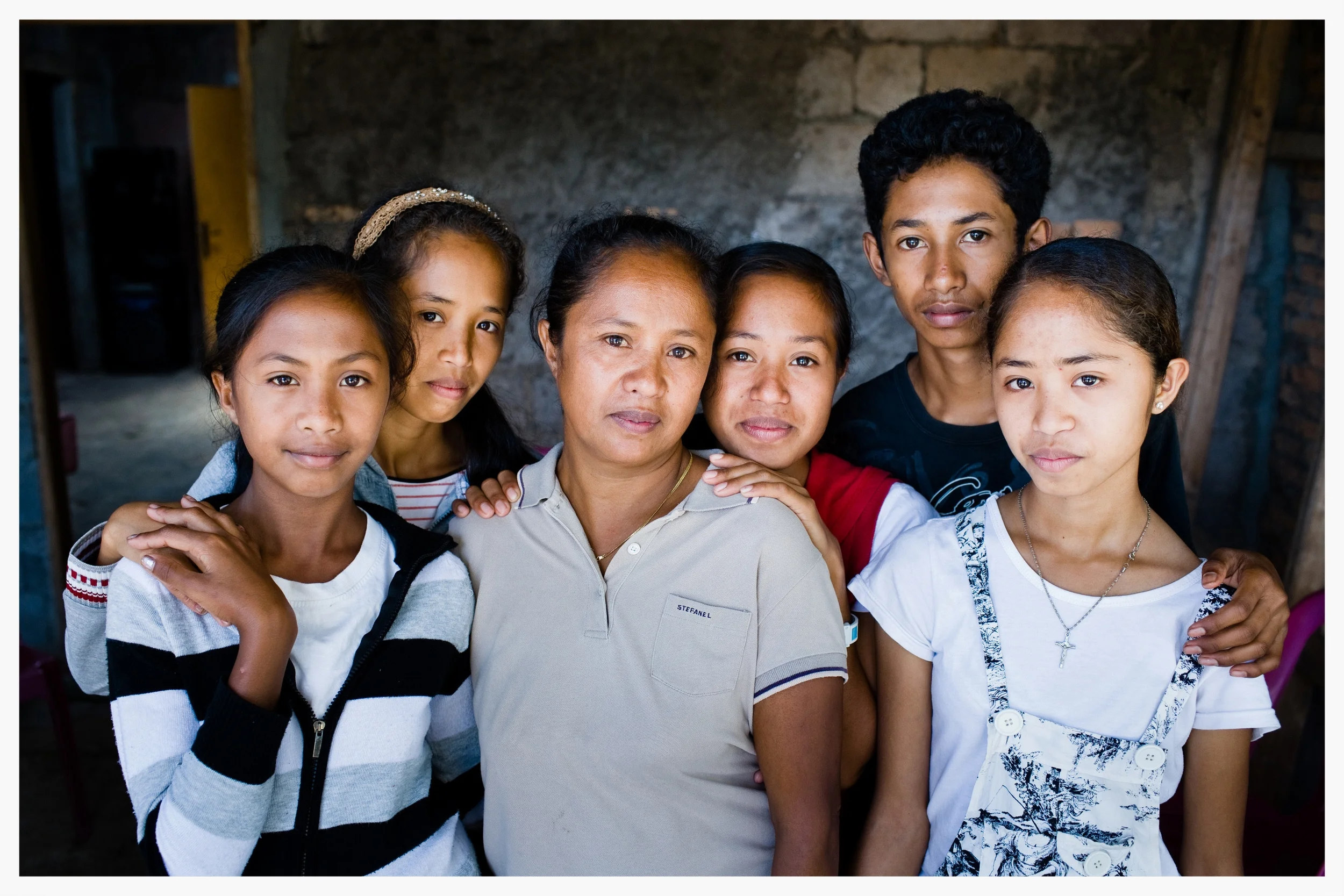 Jelia Boavida de Jesus at home with her children. East Timor. Photo: © Marcus Perkins