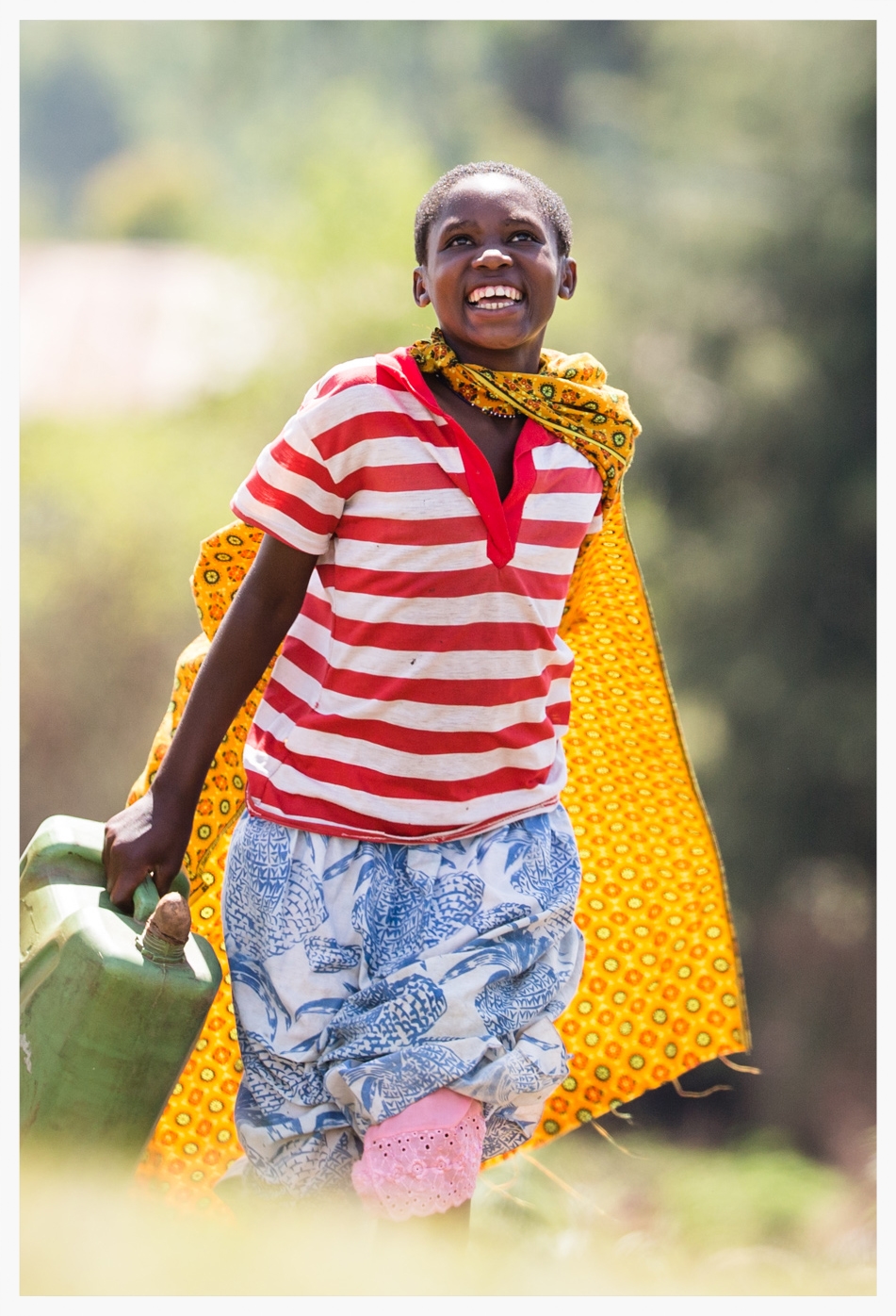 Jouvllet on her last run to collect water before the family's rainwater harvesting system is commissioned. Photo © Marcus Perkins
