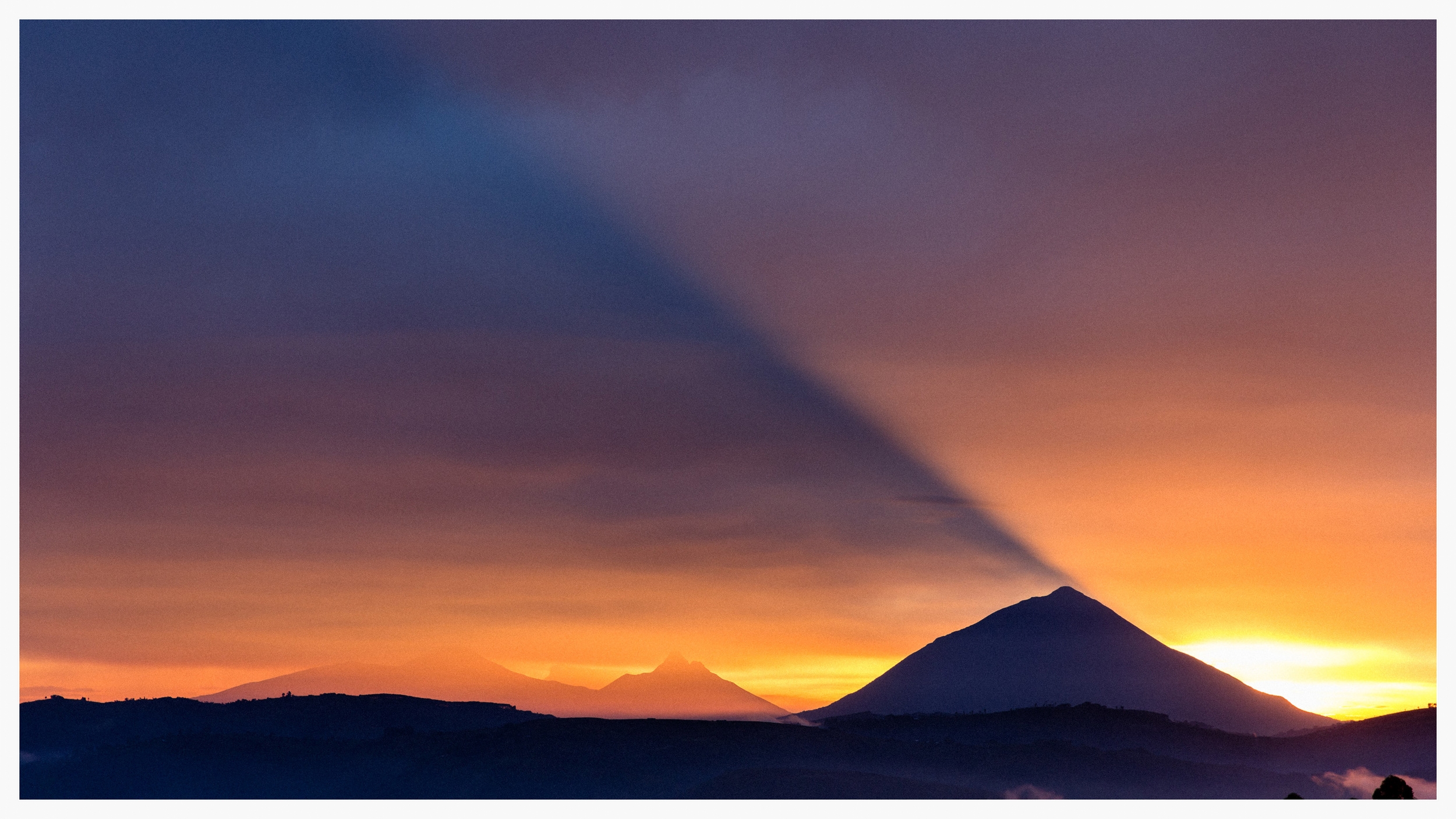 The sun setting over Kigezi, which covers the districts of Kabale, Kisoro and Rukungiri in south west Uganda. Photo © Marcus Perkins