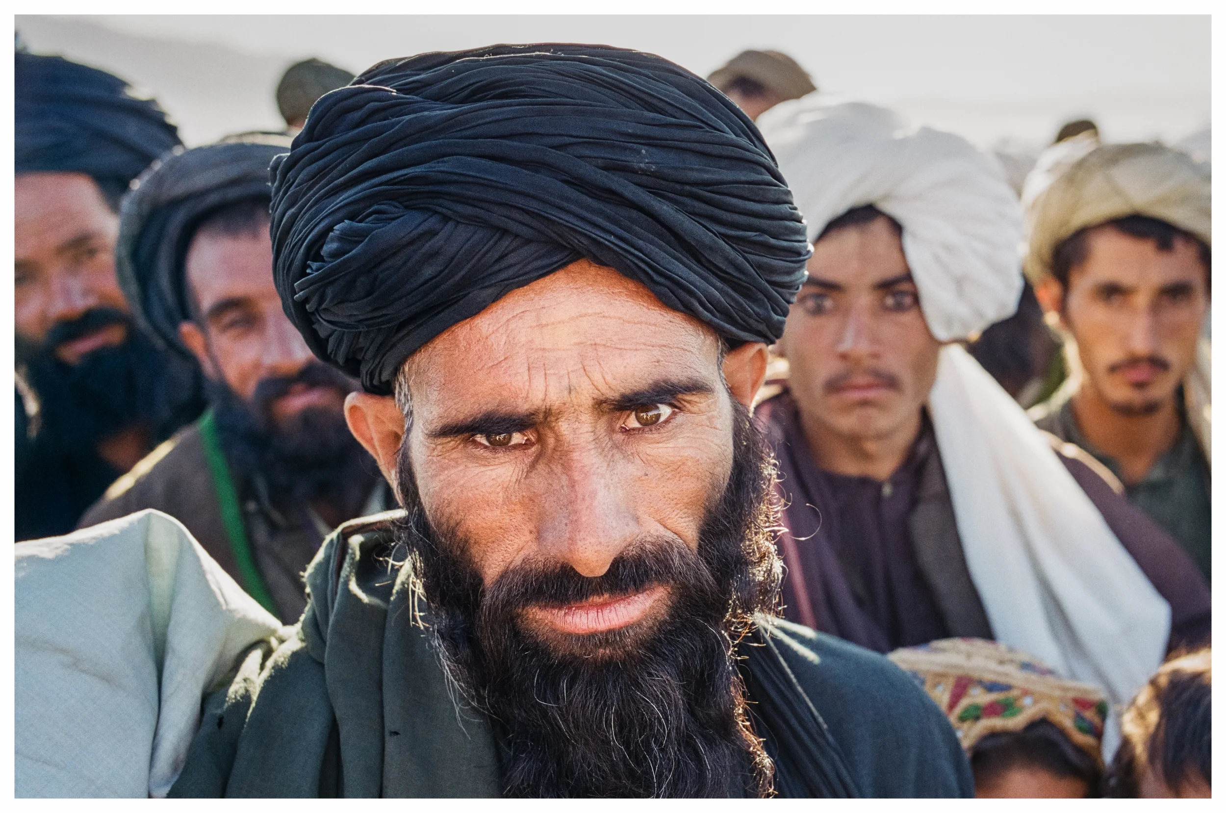 Afghans always study foreigners with an intense curiosity, but behind the piercing eyes you'll often find a warm welcome. Photo © Marcus Perkins