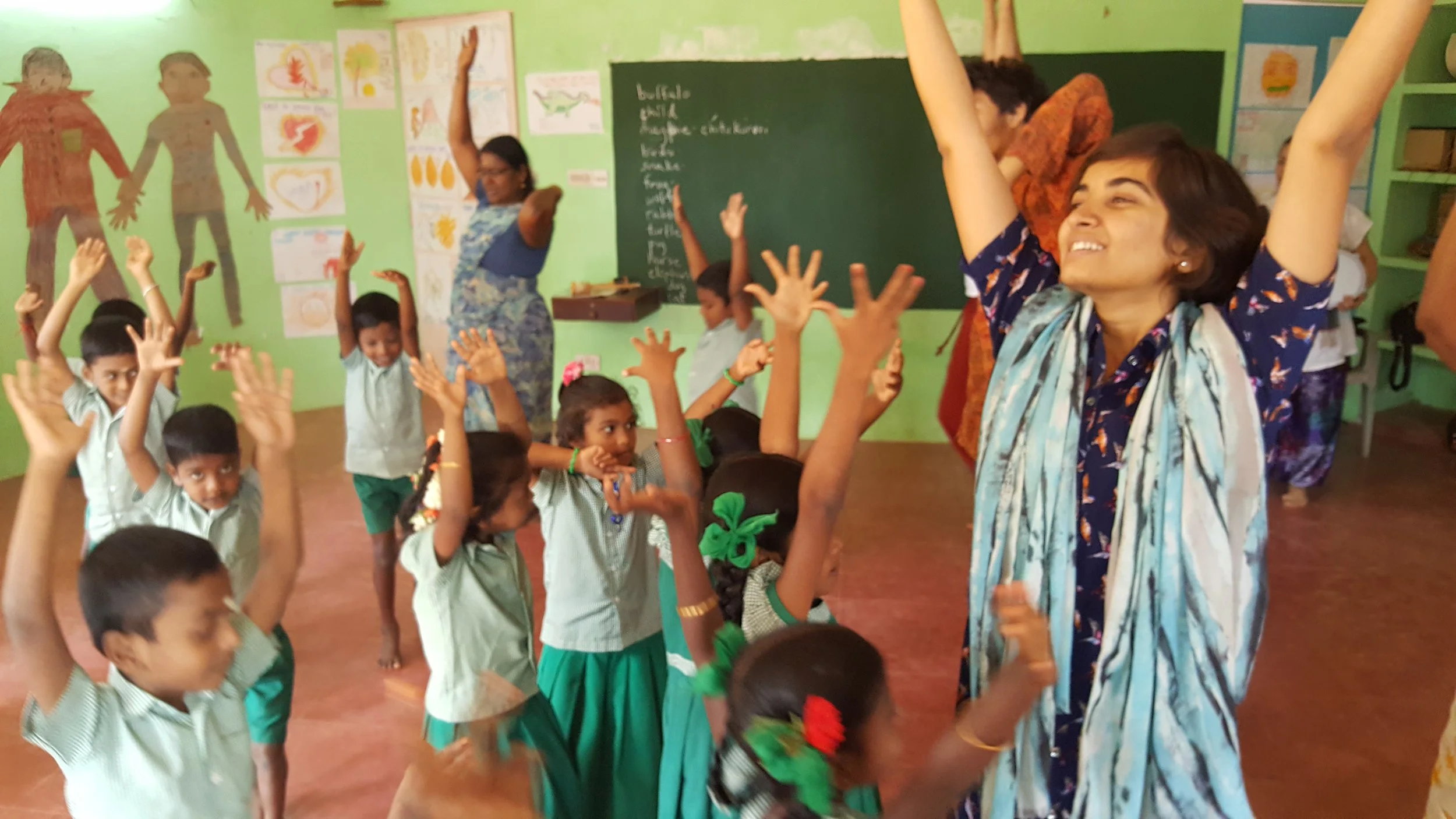 Teacher, Usha, working with the students at Akiyam School. 