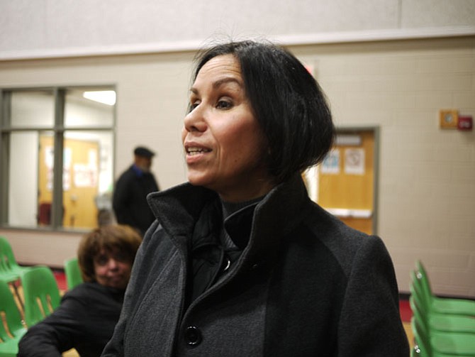 Raquel Page talks after the January meeting about Fire Station #8. Photo by Eden Brown/Gazette Packet