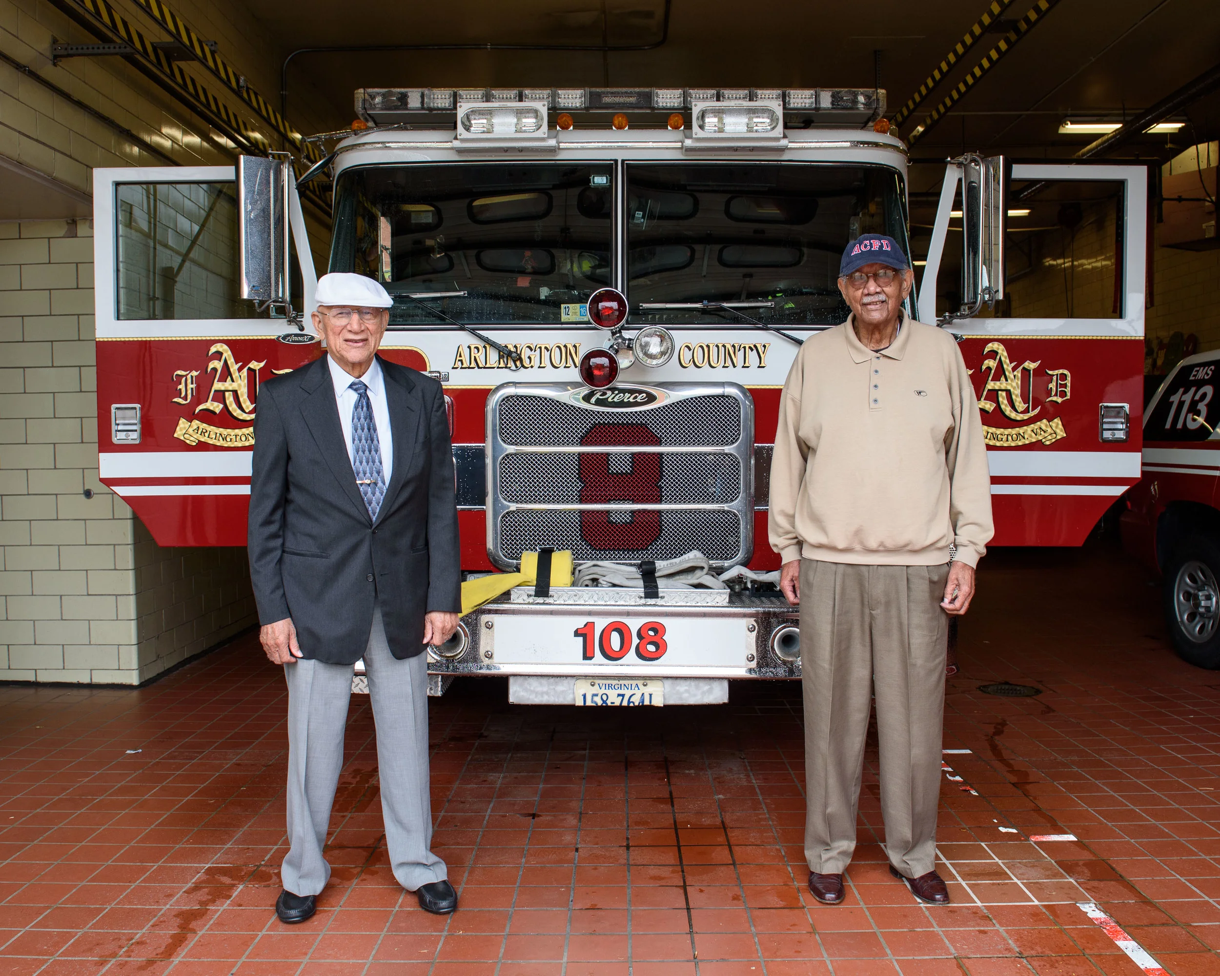 Captain Hartman Reed, left, and Firefighter Julian Syphax, right, pose for a portrait at Fire Station 8.