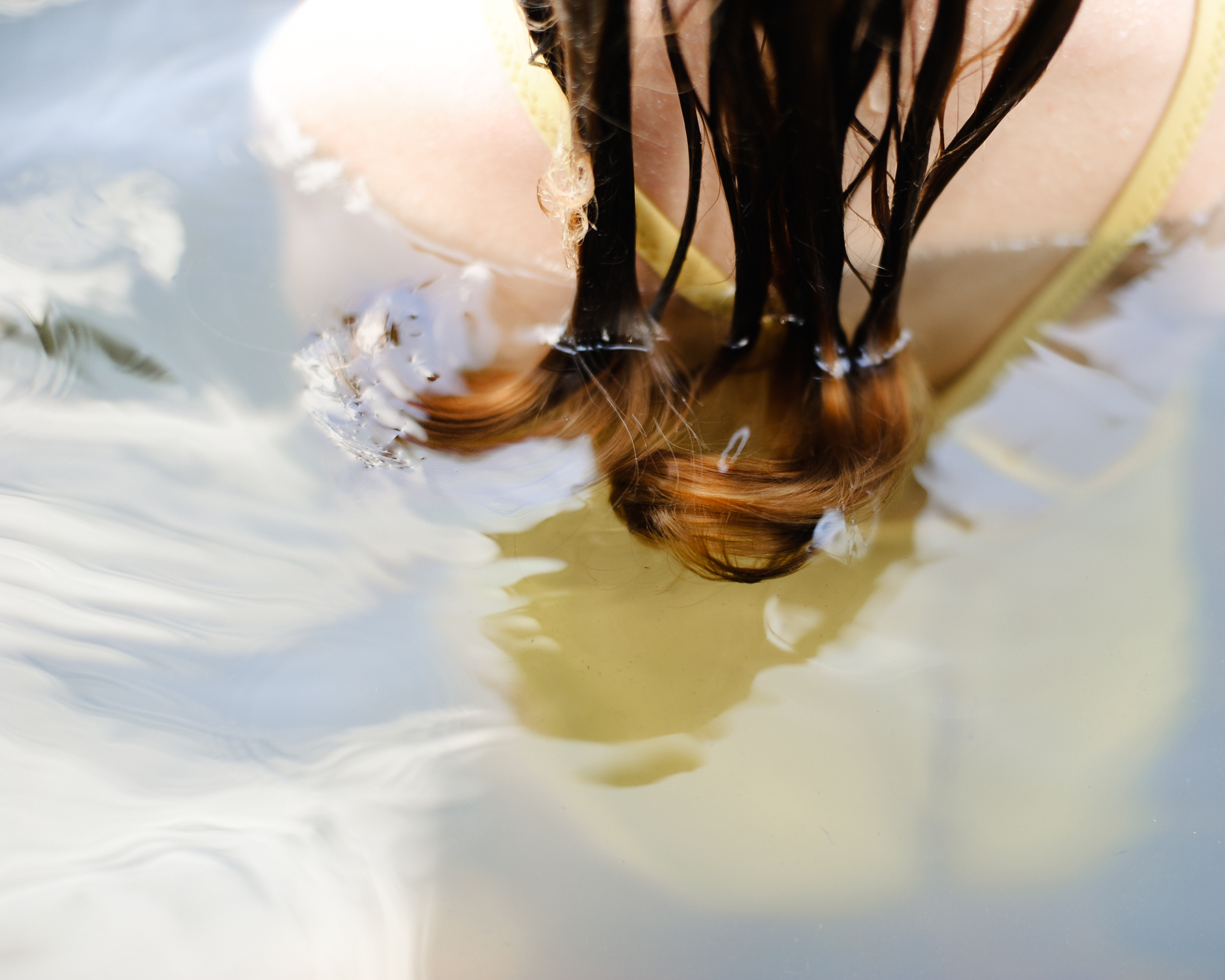 girls hair curls floating in water - maine children's portrait photography