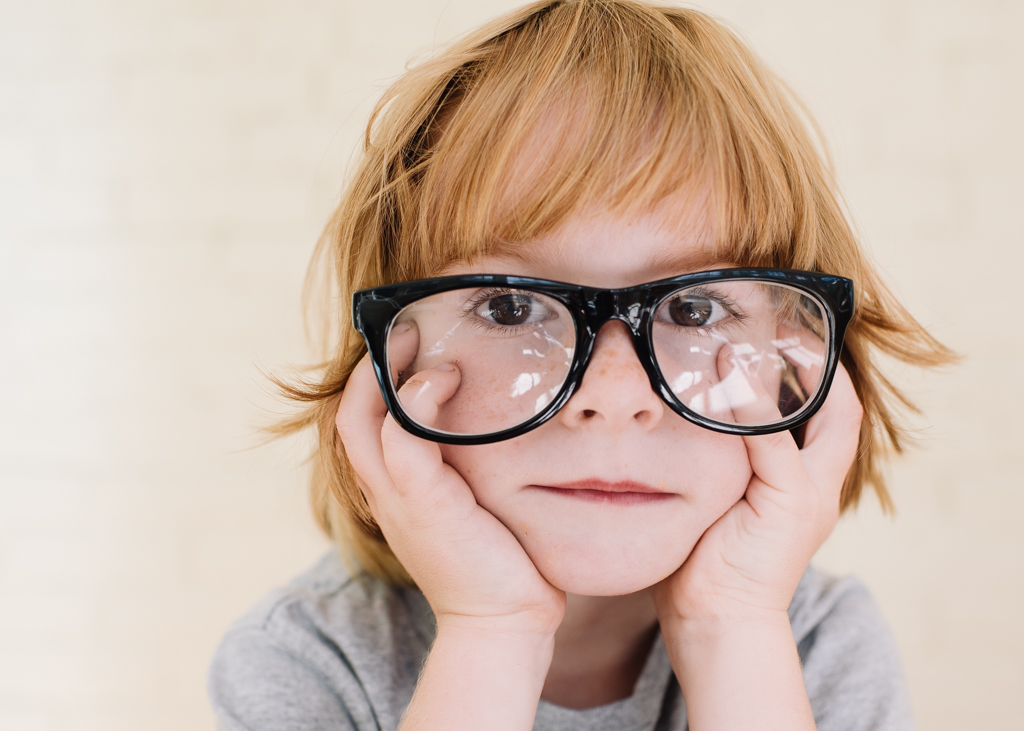 boy in glassese that are too big - maine editorial photographer
