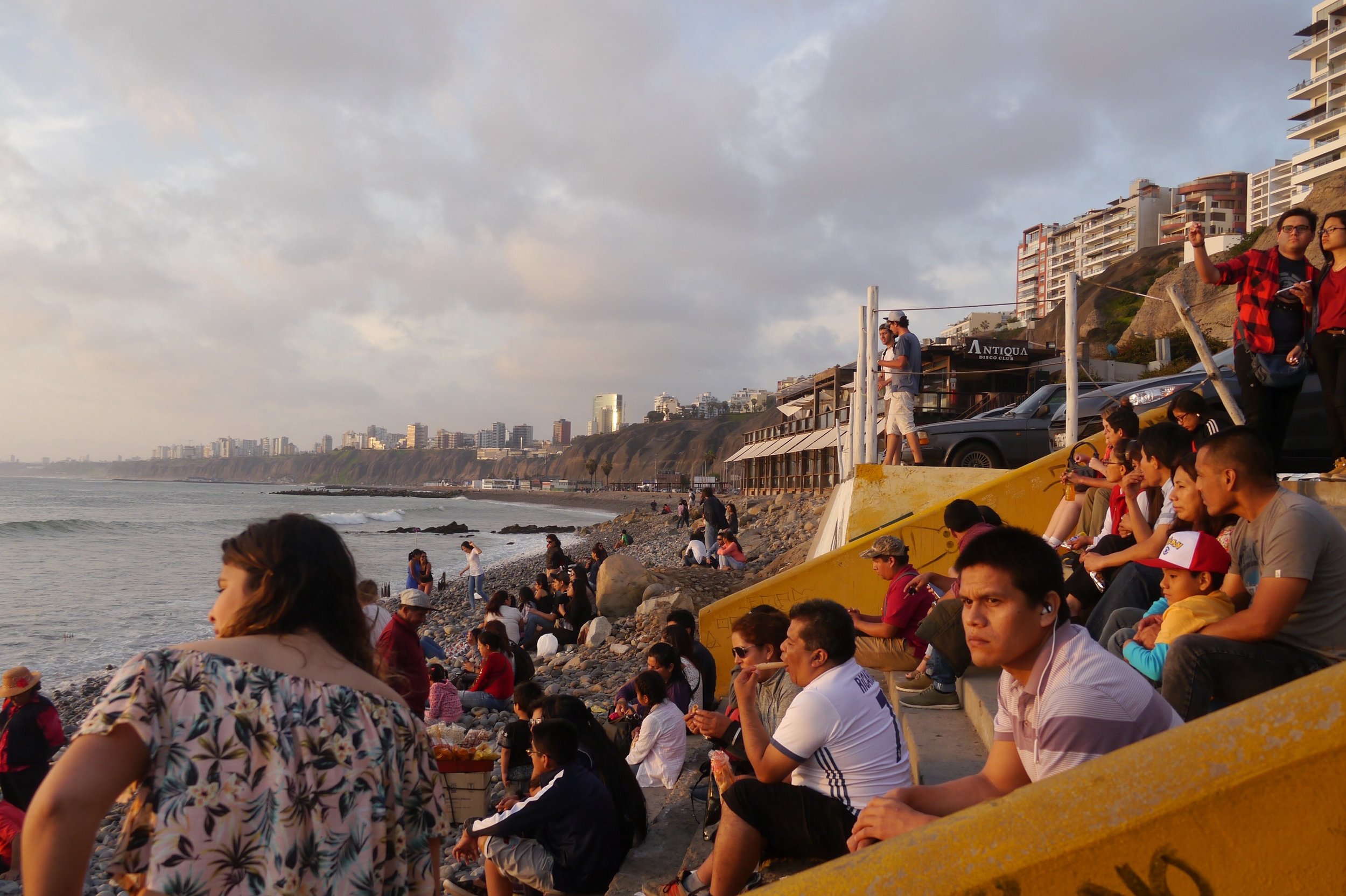  Peruvians take in the late afternoon sun and air in Lima. 