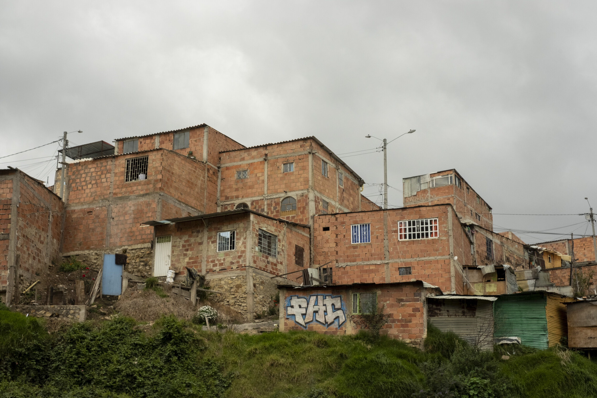 One of thousands of brick-clad homes constructed in Ciudad Bolivar by poor Colombian families fleeing political violence, land displacement, or simply better economic opportunies in Bogotá.  