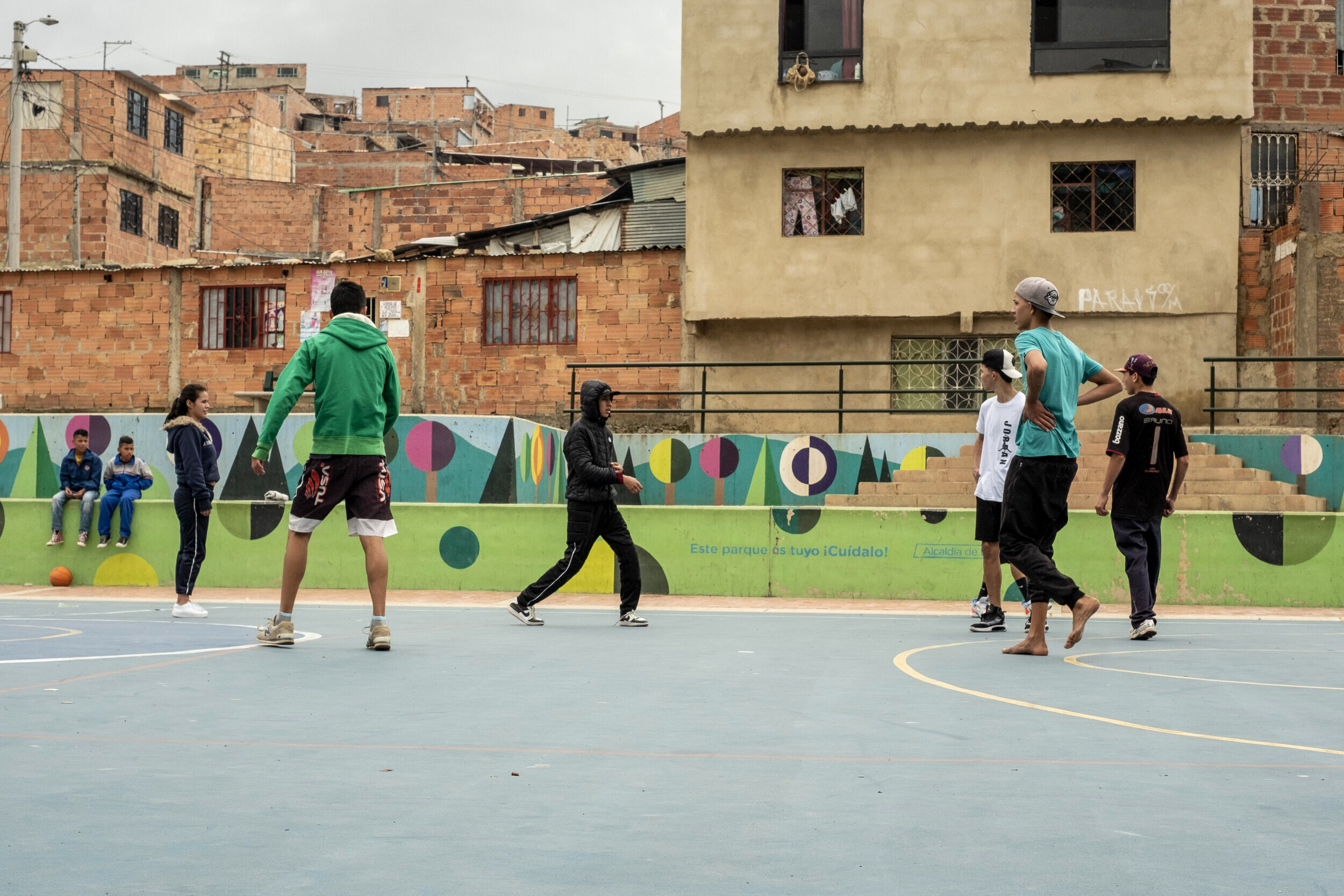  A group of young Venezuelans play soccer on a new concrete pitch in Illimani Park in the El Paraíso neighborhood in Ciudad Bolivar, Bogotá. 