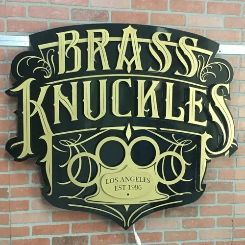 Brass Knuckles Sign Without the Lights On