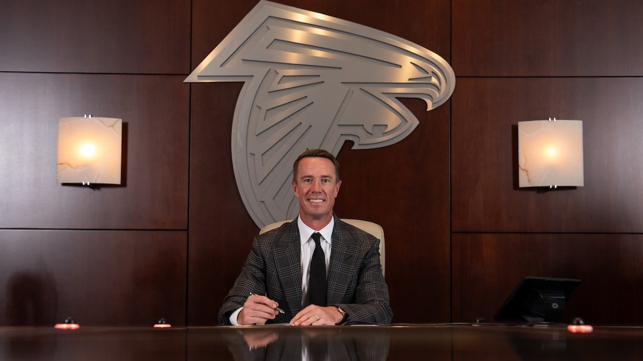 Hey business owners! Even sports stars like Matt Ryan understand the power of a strong brand.  That's him signing his retirement papers in front of the iconic Atlanta Falcons logo (a perfect example of the lasting impact of signs).

Want to solidify 