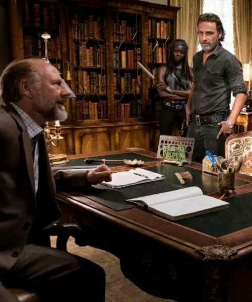 Gregory listens intently to one of Rick's group