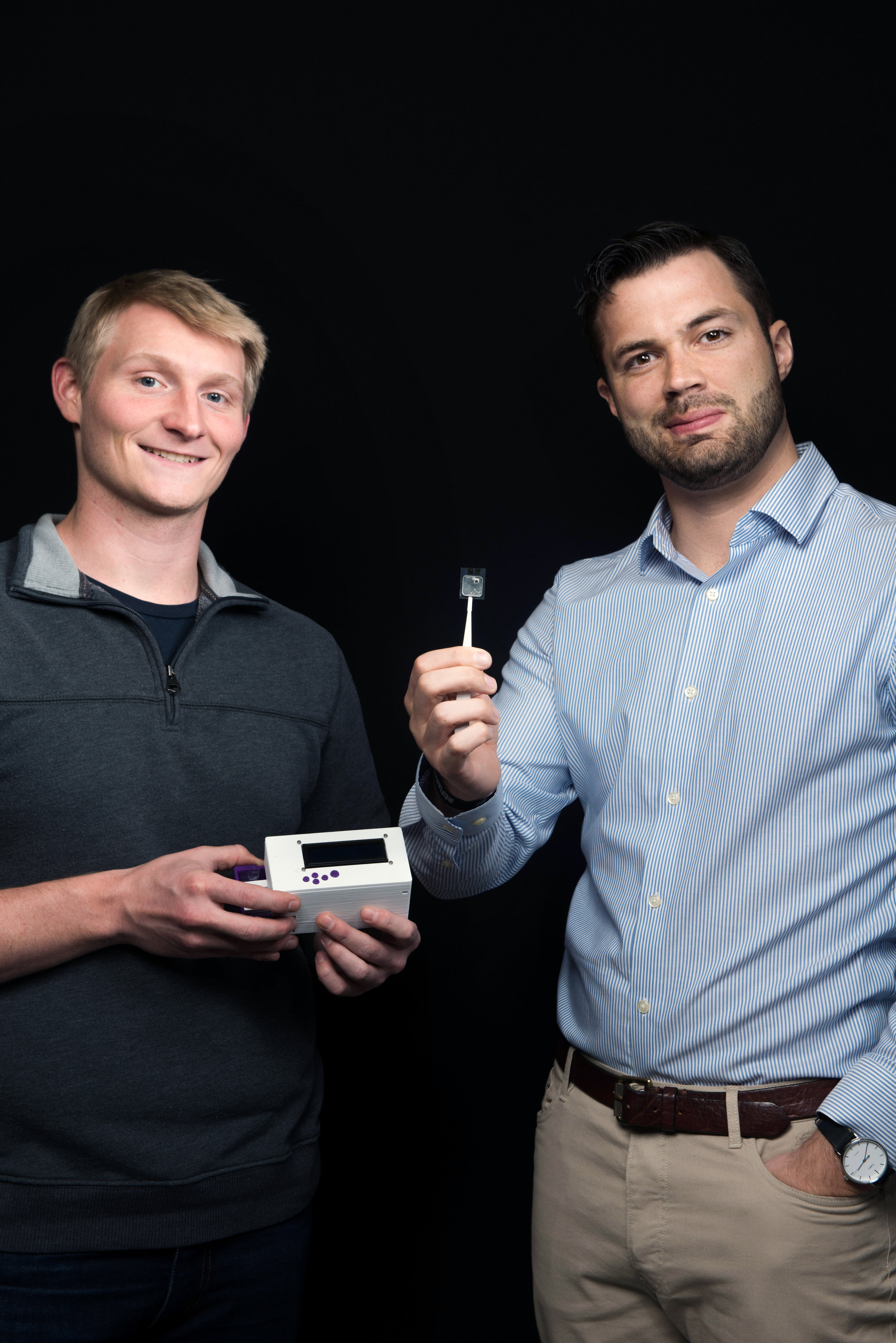 Molecular Innovations Director, David Baisch, and Lead Conservation Product Engineer, Dr. Hal Holmes, display an early prototype of the NABIT.