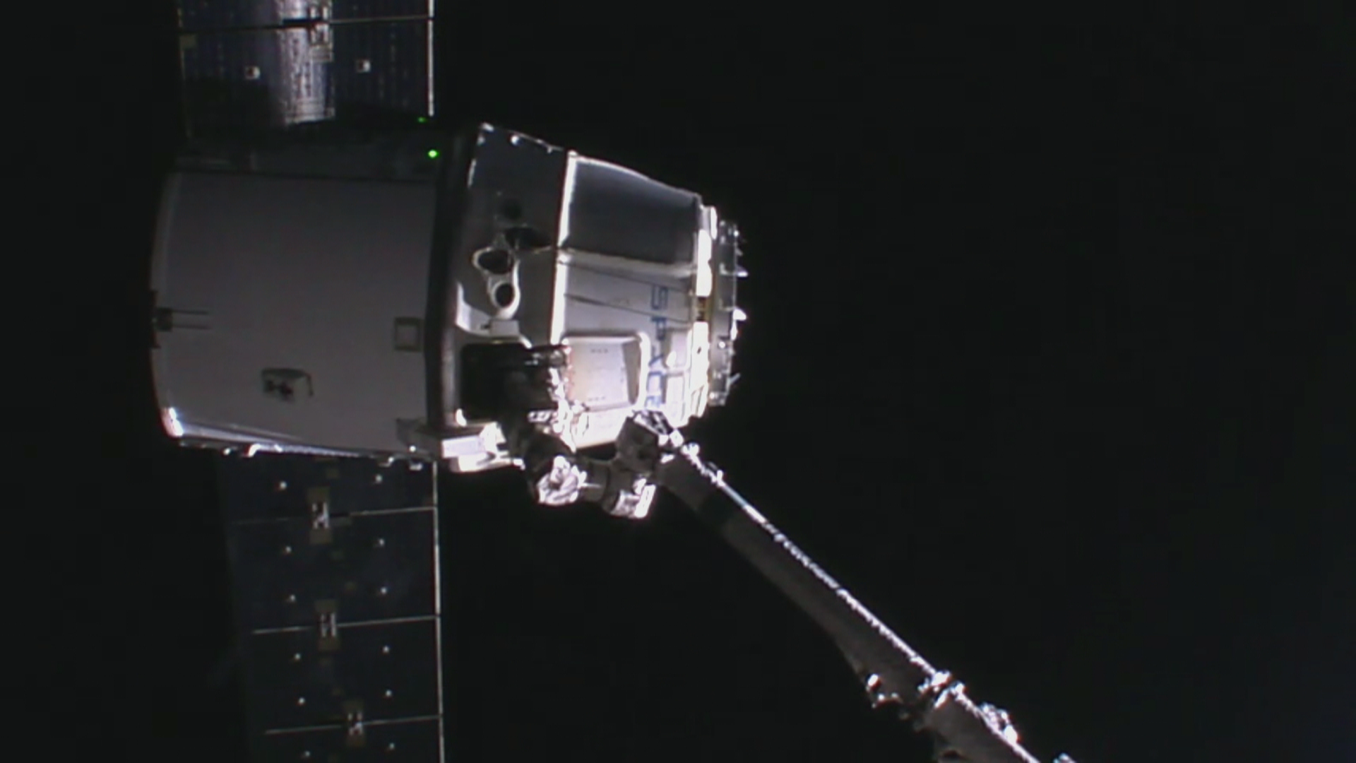 R2D2? No. SpaceX Dragon coming into berth with the help of the Canada arm