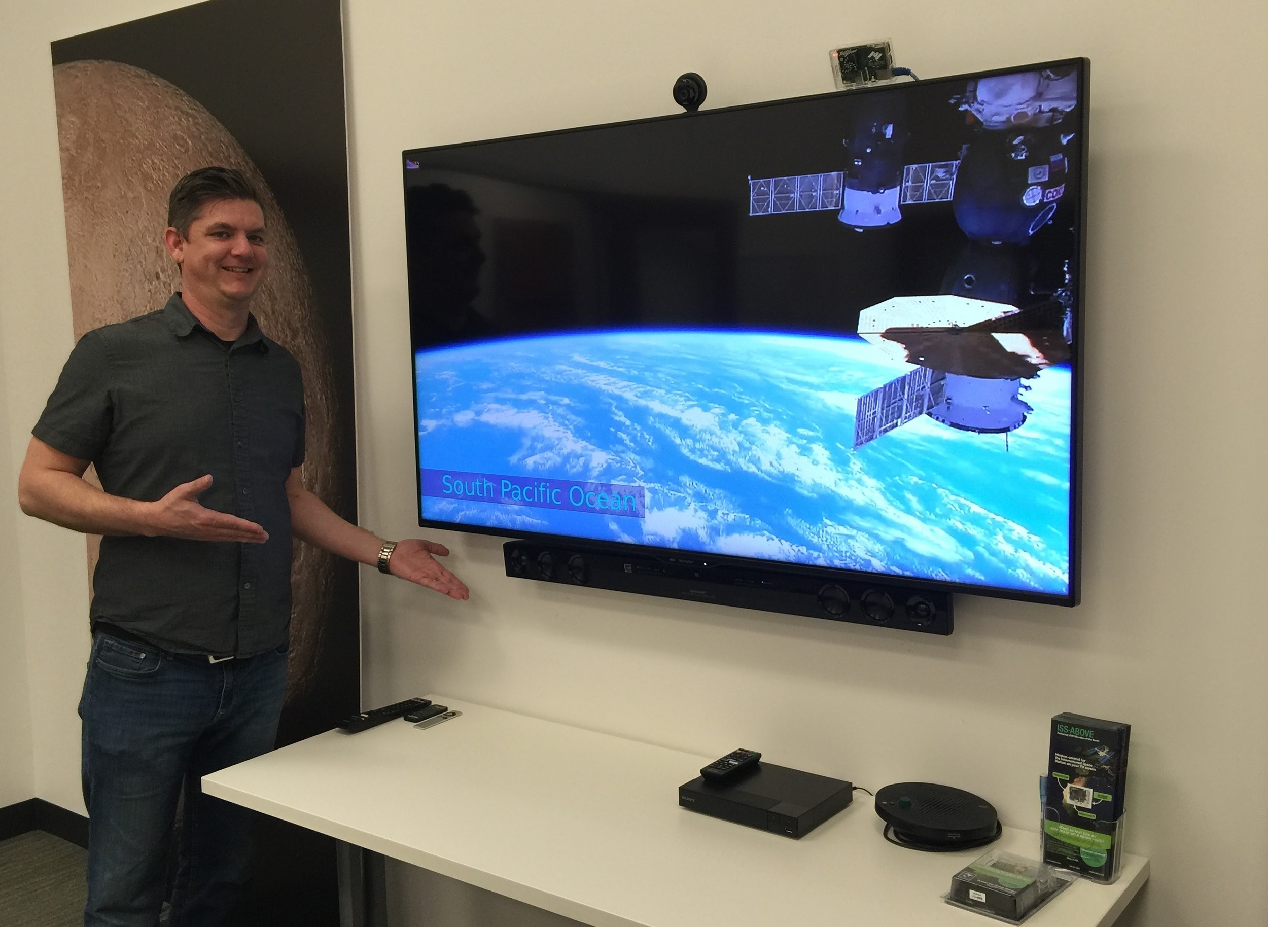 Brandon Shoelz standing beside the ISS-Above / TV