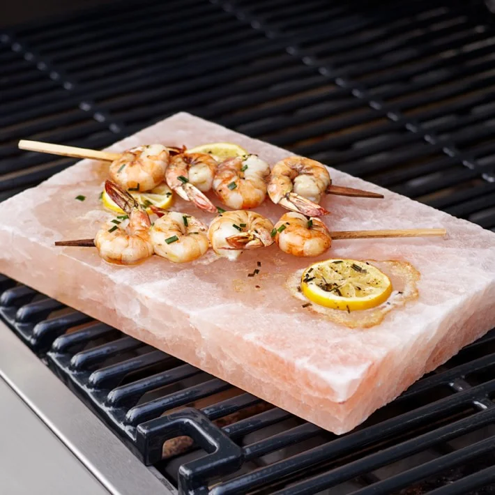 Want a beautiful AND functional Christmas gift? This Pink Himalayan Salt Plate is the most unique gift to give to the person in your life that loves to cook! This plate is sourced from natural salt deposits found in the Himalayas and its crystalline composition adds complex flavor to all types of foods. Wondering how to use it? Heat on the grill to sear seafood and meat, or chill for serving a selection of fruits, vegetables and cheeses with a hint of salt. Talk about a beautiful presentation! 