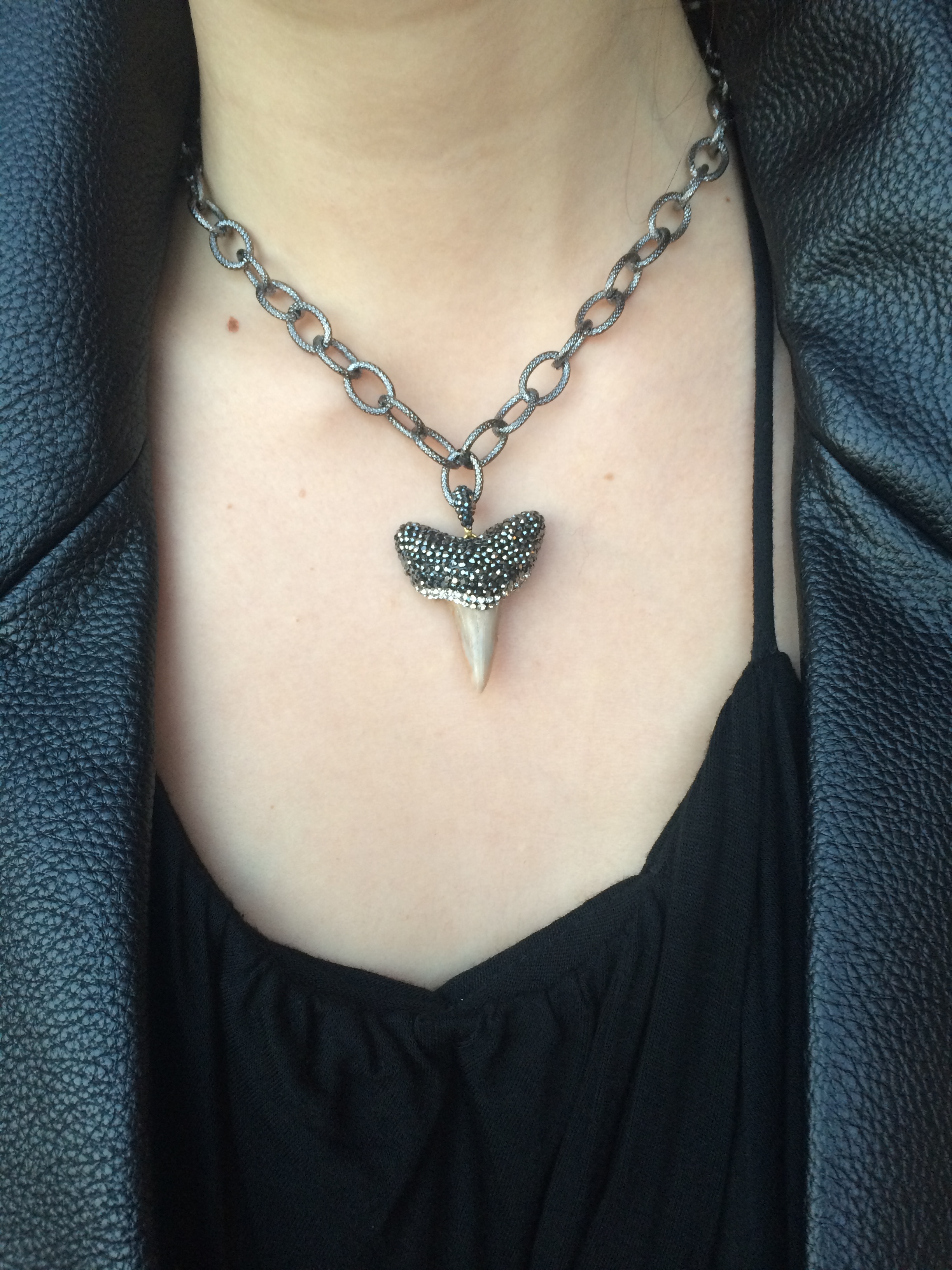 Turn heads with this rhinestone druzy sharks tooth necklace on oxidized chain! We suggest pairing this stunner with everything from a basic white t-shirt & jeans to your favorite little black dress for your office holiday party! $65.