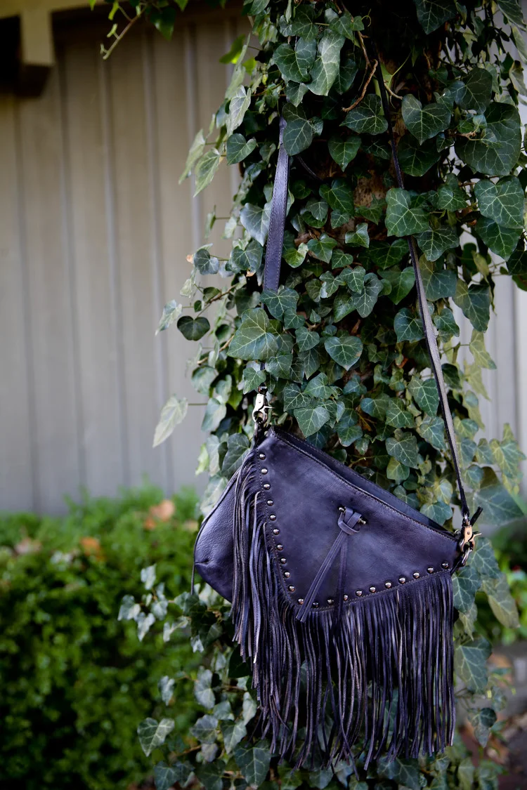 Another easy favorite is this Grey Fringe Leather Purse. 