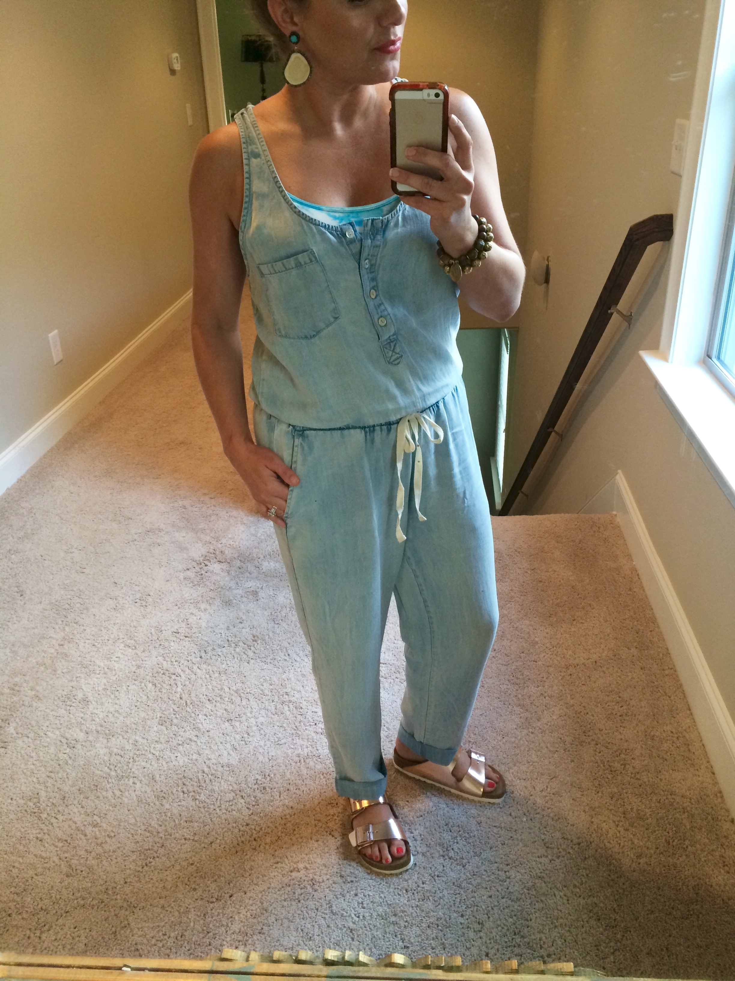 Styled in a casual way with Birkenstocks and fun colored bralette underneath! 