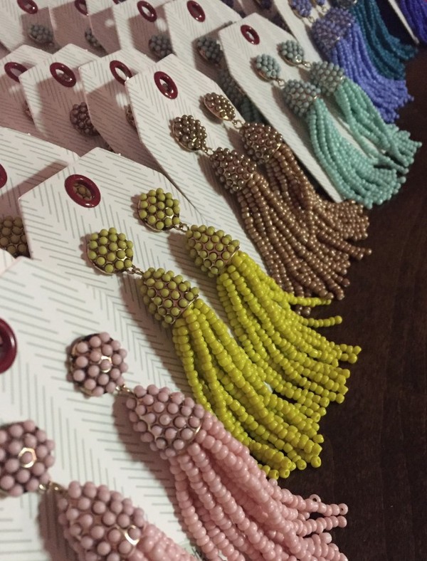 Yellow beaded tassel earrings.