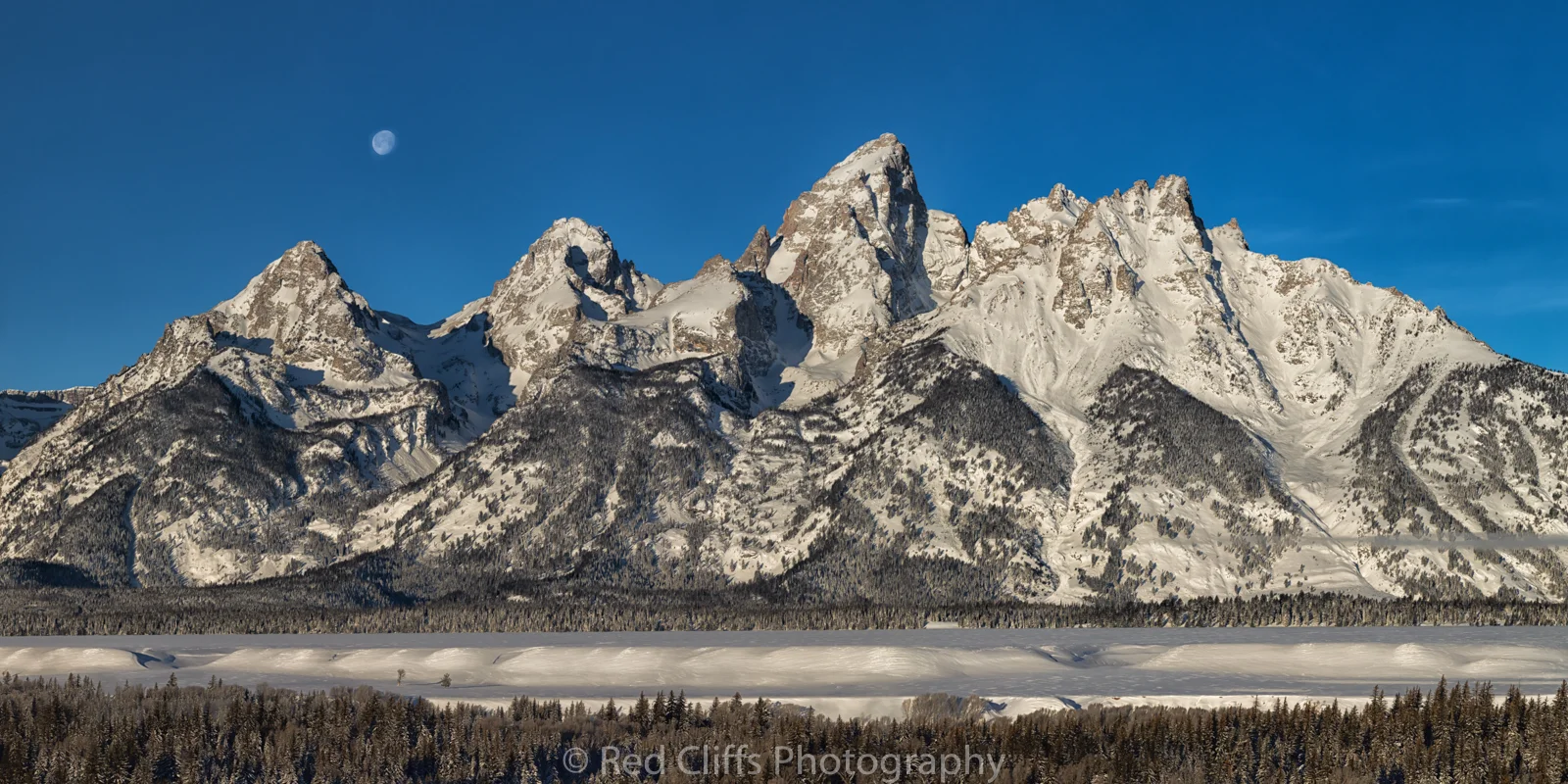 Moon setting the next morning over the Tetons