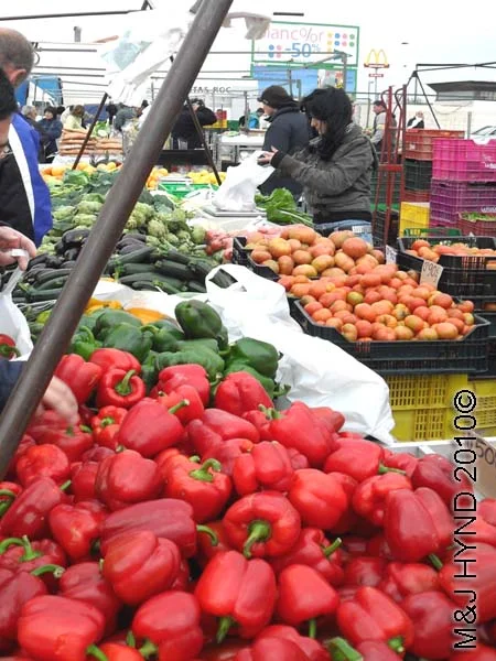 santa pola market red peppers: spain santa Pola Saturday market, red green peppers, courgettes, tomatoes