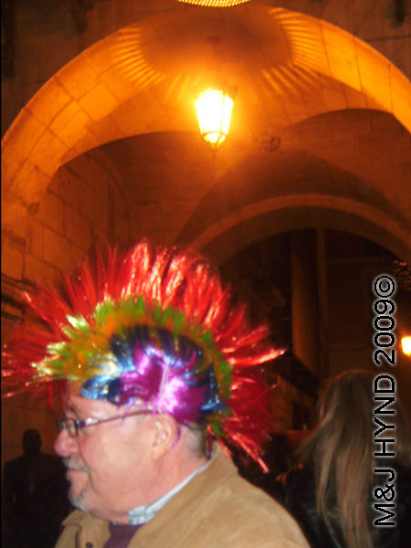 spain downtown Alicante, fiesta nochevieja New Years Eve, revellers, multi-coloured mohawk 