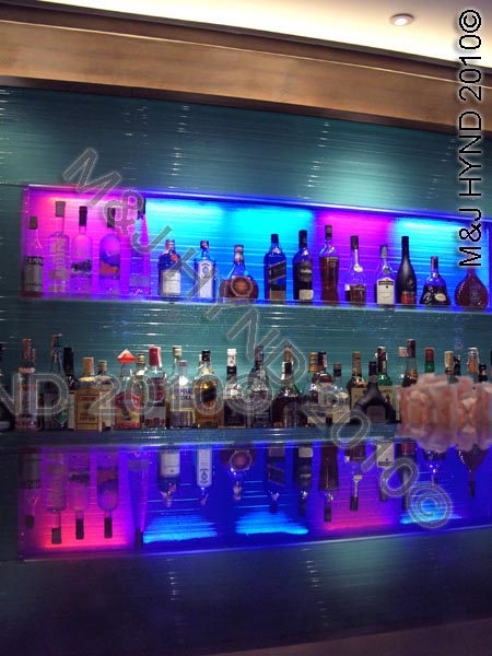 wellington: NZ, Lambton Quay, Wellington, Wine Bar floating, backlit light glass panel, creative, glass shelves, glass counter reflection, LED colour panels, custom design