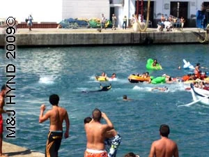 bull in the water: spain Javea Fiesta, Bous a la Mar, bullring Javea port, bull in sea, chasing lilos