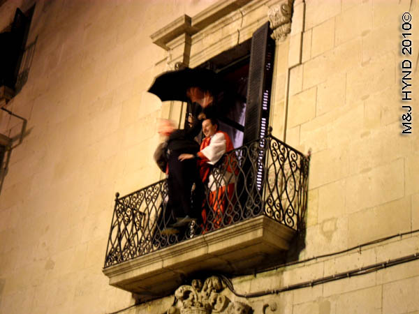 puppet about to be thrown / mediaeval #4: spain Alicante Carnival Fiesta, Costa Blanca, at the plaza condemned man about to be thrown from upper window