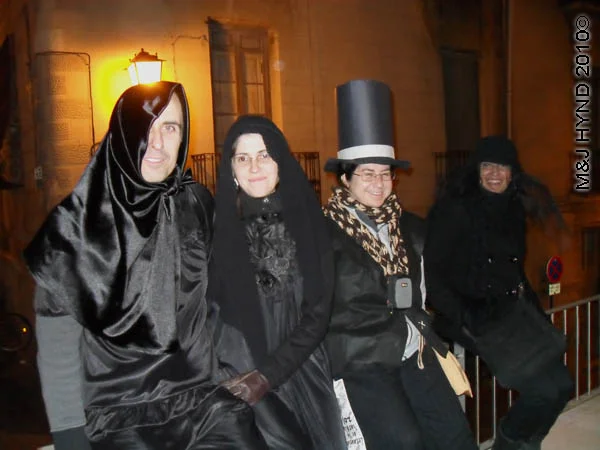 black mourners: spain Alicante Carnival Fiesta, Costa Blanca, darkened street, dressed in black, in mourning, top hat and tails