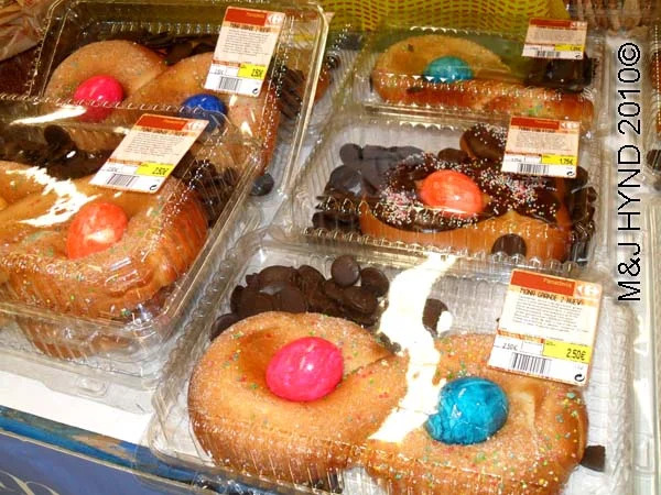 easter treats: spain elche, Semana Santa Holy Week, pastry doughnuts, multi-coloured eggs, chocolate buttons