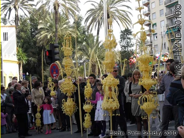 spain elche, Semana Santa Holy Week, Palm Sunday, Domingo de Ramos, close-up intricate white-palm leaves, spectators