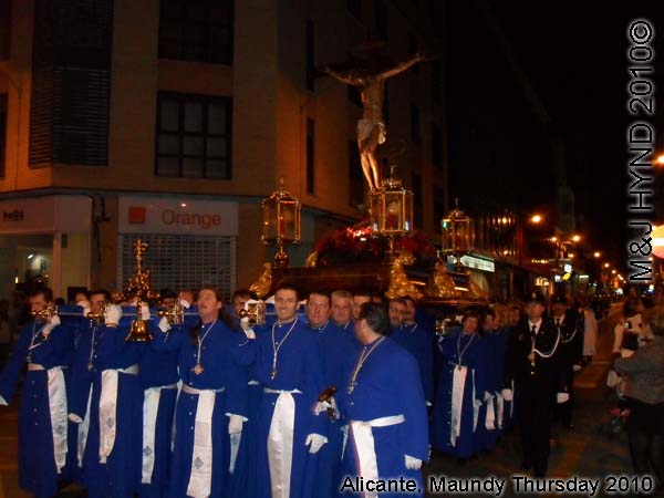  spain Alicante, Semana Santa Holy Week, Maundy Thursday procession, Brotherhood long blue capes, paso-bearers religious floats, silver Jesus's sculpture, somber march 