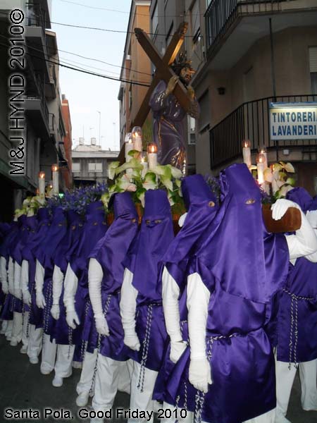  spain Santa Pola, Semana Santa Holy Week, Good Friday procession, Brotherhood long capes, gloves, paso-bearers religious floats, Jesus's sculpture, somber march, blue hood, uniforms 