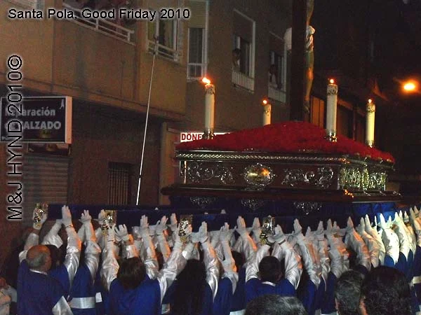 spain Santa Pola, Semana Santa Holy Week, Good Friday procession, Brotherhood long capes, gloves, paso-bearers religious floats, Jesus's sculpture, somber march, uniforms, intricate moves