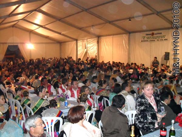 crowd in the hall: spain perleta maitino St Vicente de Ferrer Fiesta, kings queens, ladies-in-waiting, traditional long ballgowns, tuxedo, winner's sashes, long trestle tables