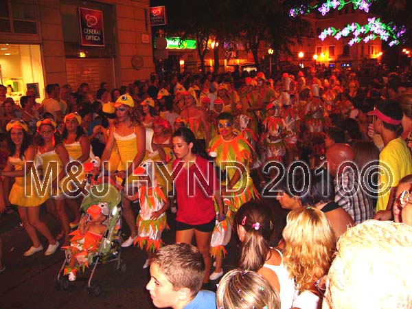charanga / chickens: spain elche Fiesta fun parade, procession fiesta-goers disguises Charanga, dressed as chickens, festive streetlights, crowds