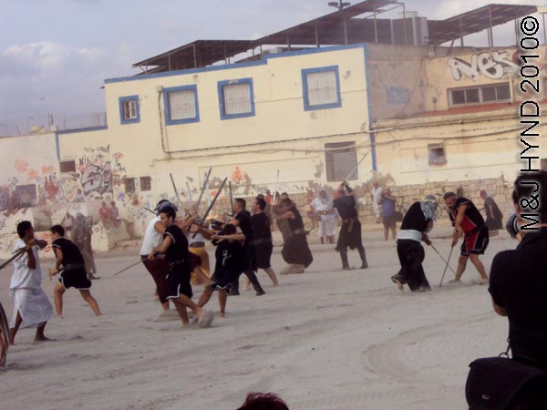 moors invade beach: spain Santa Pola Annual Fiesta, mock Moorish invasion, battles on beach
