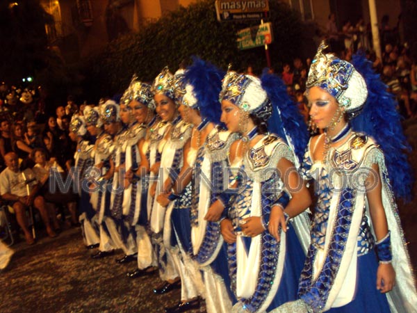 parade blu+white: spain Santa Pola Annual Fiesta, procession Moorish harem ladies, confetti