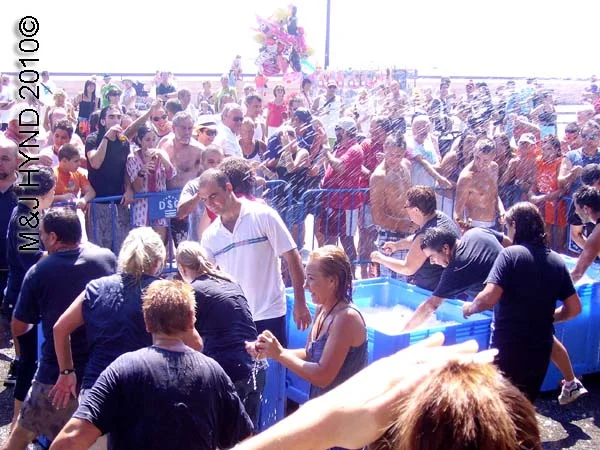 beer bath: spain Santa Pola Annual Fiesta, Santa Pola port, free beer bath, crowds