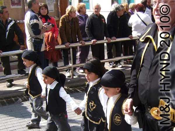 four little guys with black headbands: spain Santa Pola Annual Fiesta, four little guys with black headbands