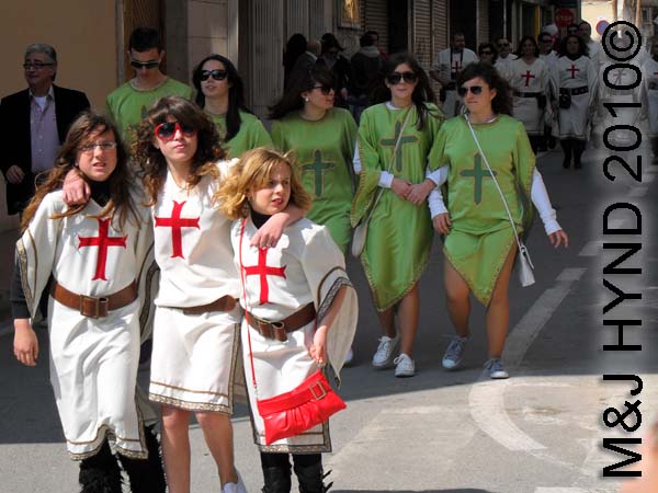 christians red+whi, as well as green: spain Santa Pola Annual Fiesta, Christians costumes parade