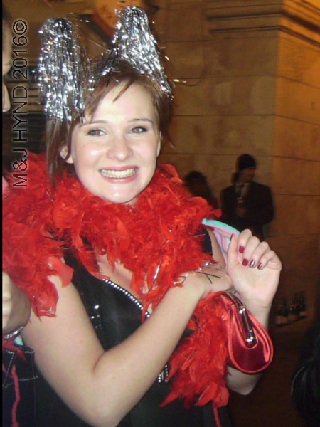 spain downtown Alicante, fiesta nochevieja New Years Eve, revellers party dress, pink shawl, feather-boa