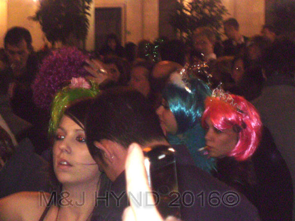  spain downtown Alicante, fiesta nochevieja New Years Eve, revellers party dress, multi-coloured wigs 
