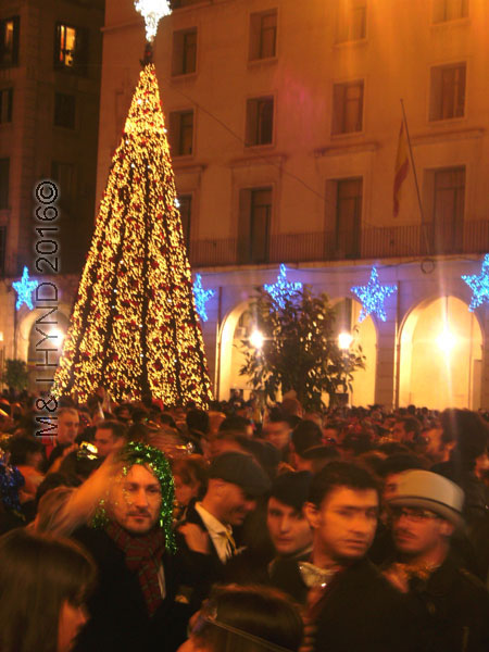 spain downtown Alicante, fiesta nochevieja New Years Eve, crowds, tall Christmas tree