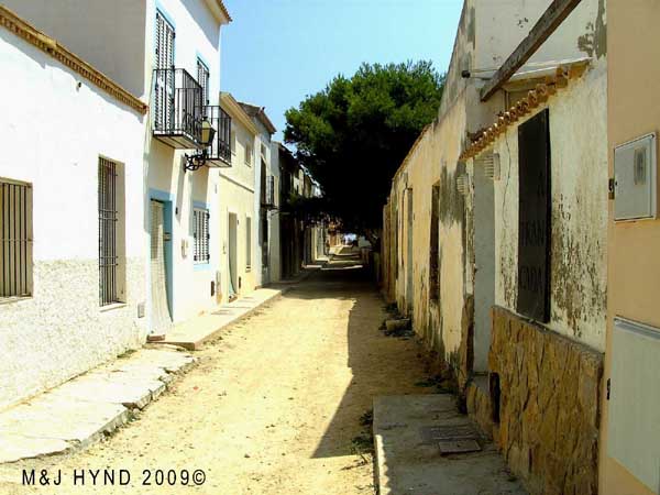 Spain isla Tabarca marine nature reserve , dry dusty cowboy and western movie, unpaved narrow lanes