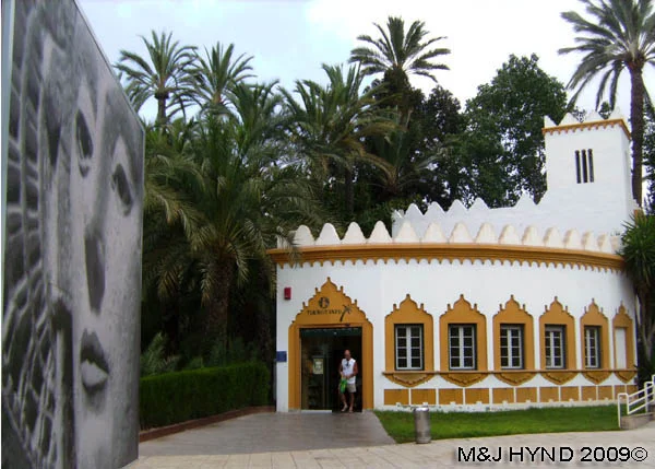 spain Elche Tourist office, Moorish architectural entrance to palmeral park , vitromosaico Dama de Elche, date palm trees